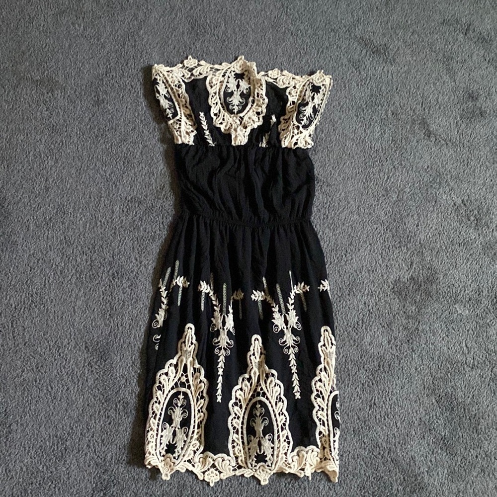 A black and white dress with very pretty designs